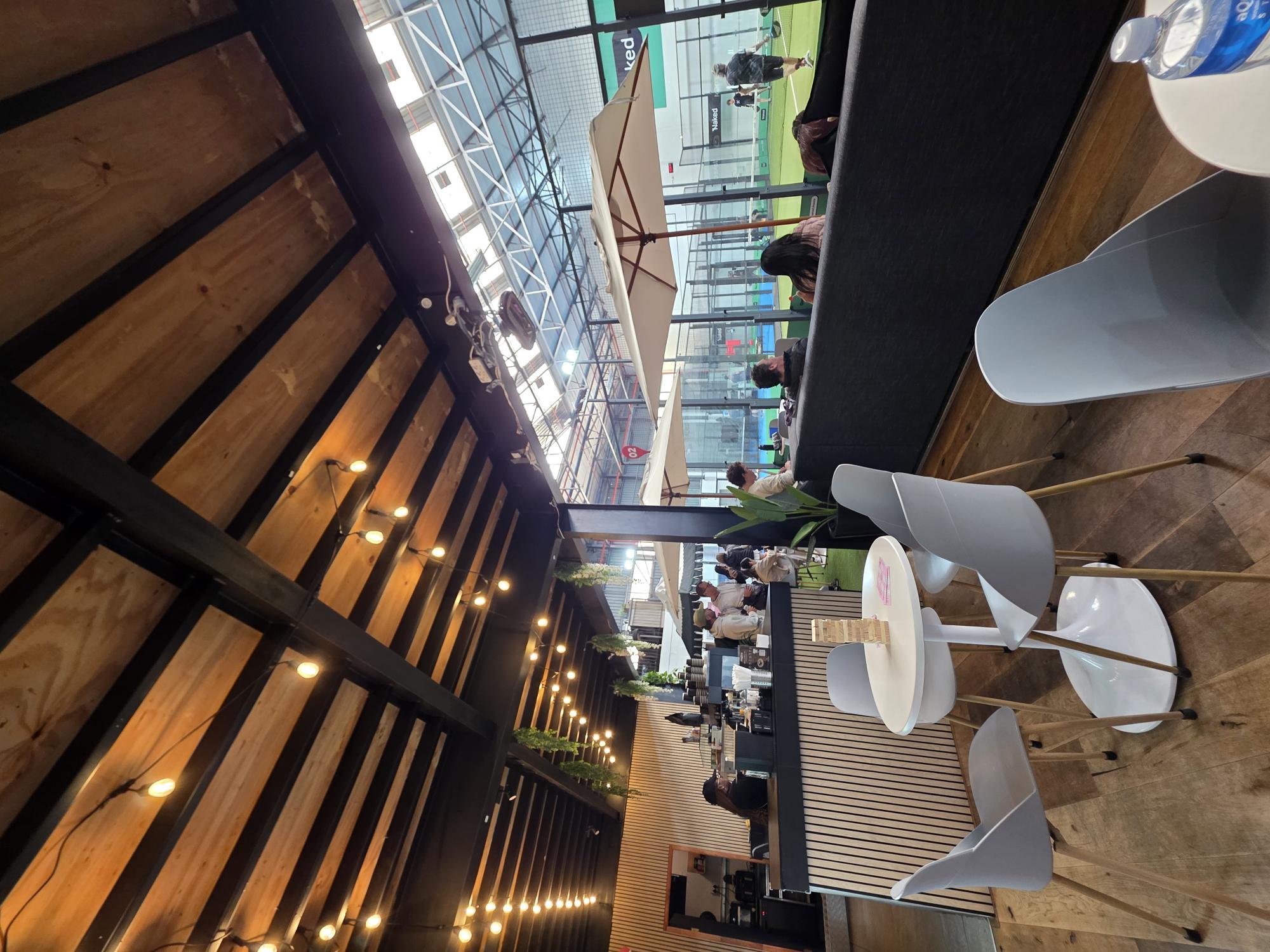 Café and lounge overlooking the padel courts